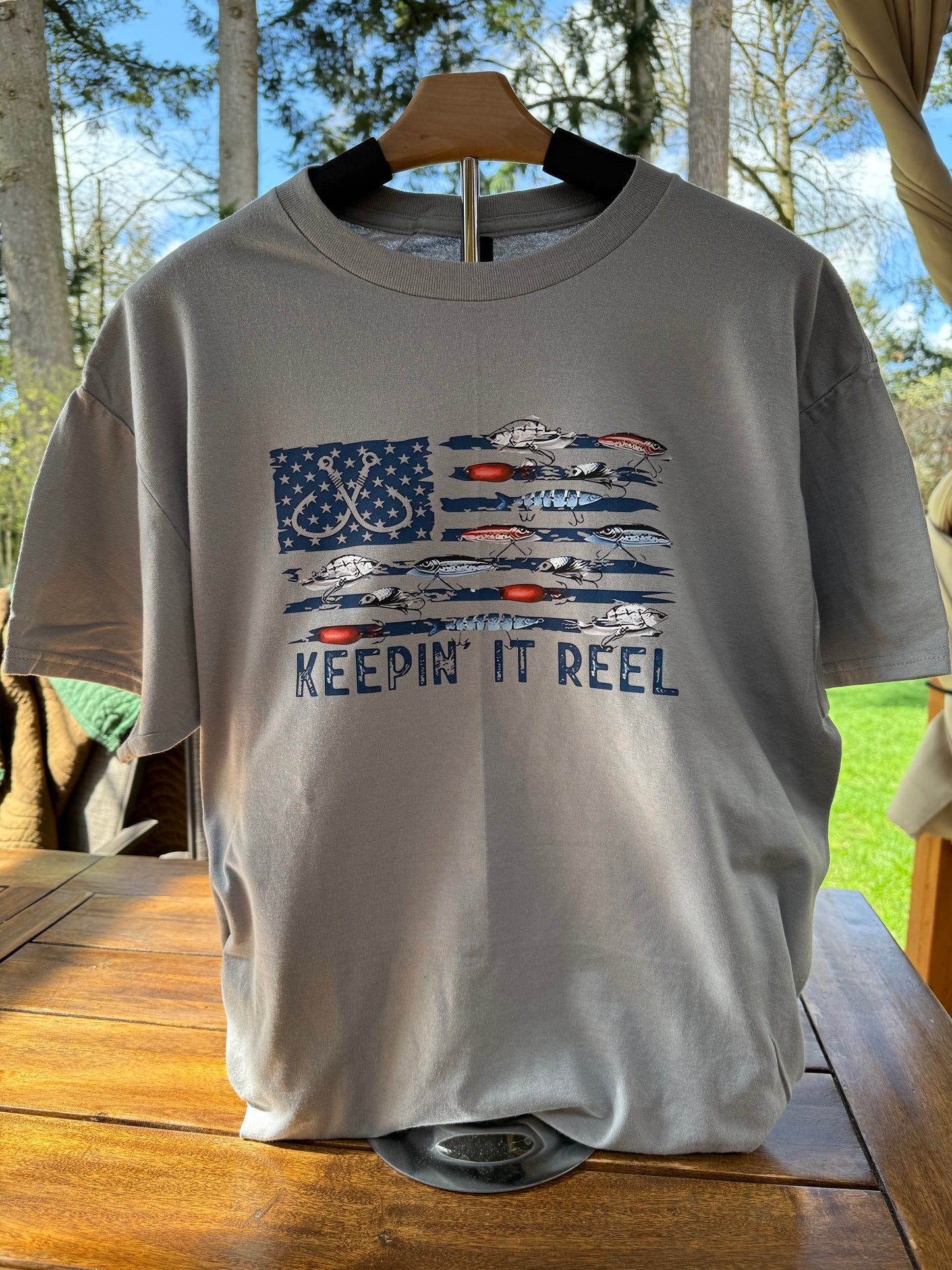 Keepin’ It Reel Fishing Shirt – Patriotic Flag Tee for Anglers and Outdoorsmen
