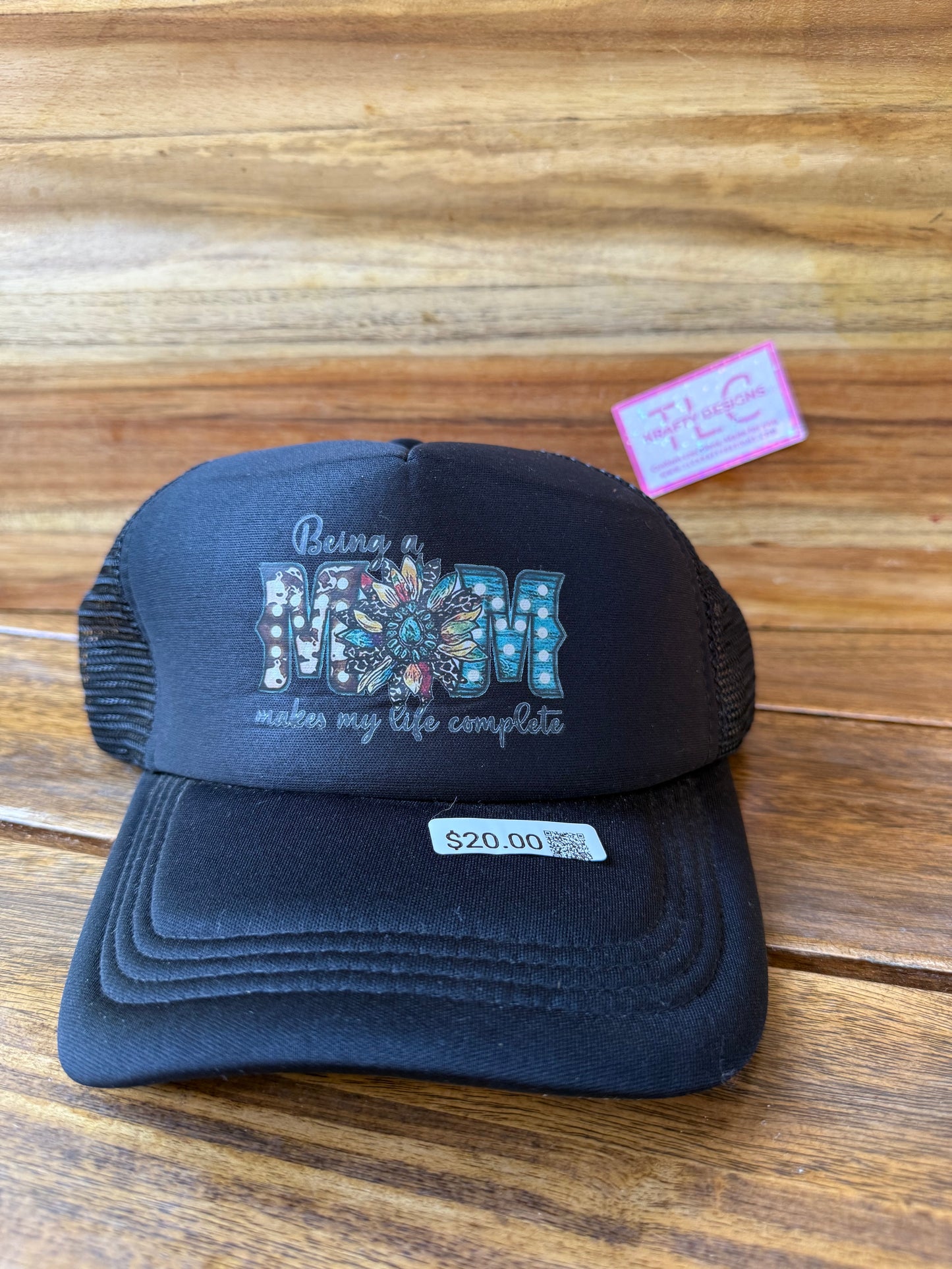 Black Trucker Hat – “Being a MOM Makes My Life Complete” Floral Patch