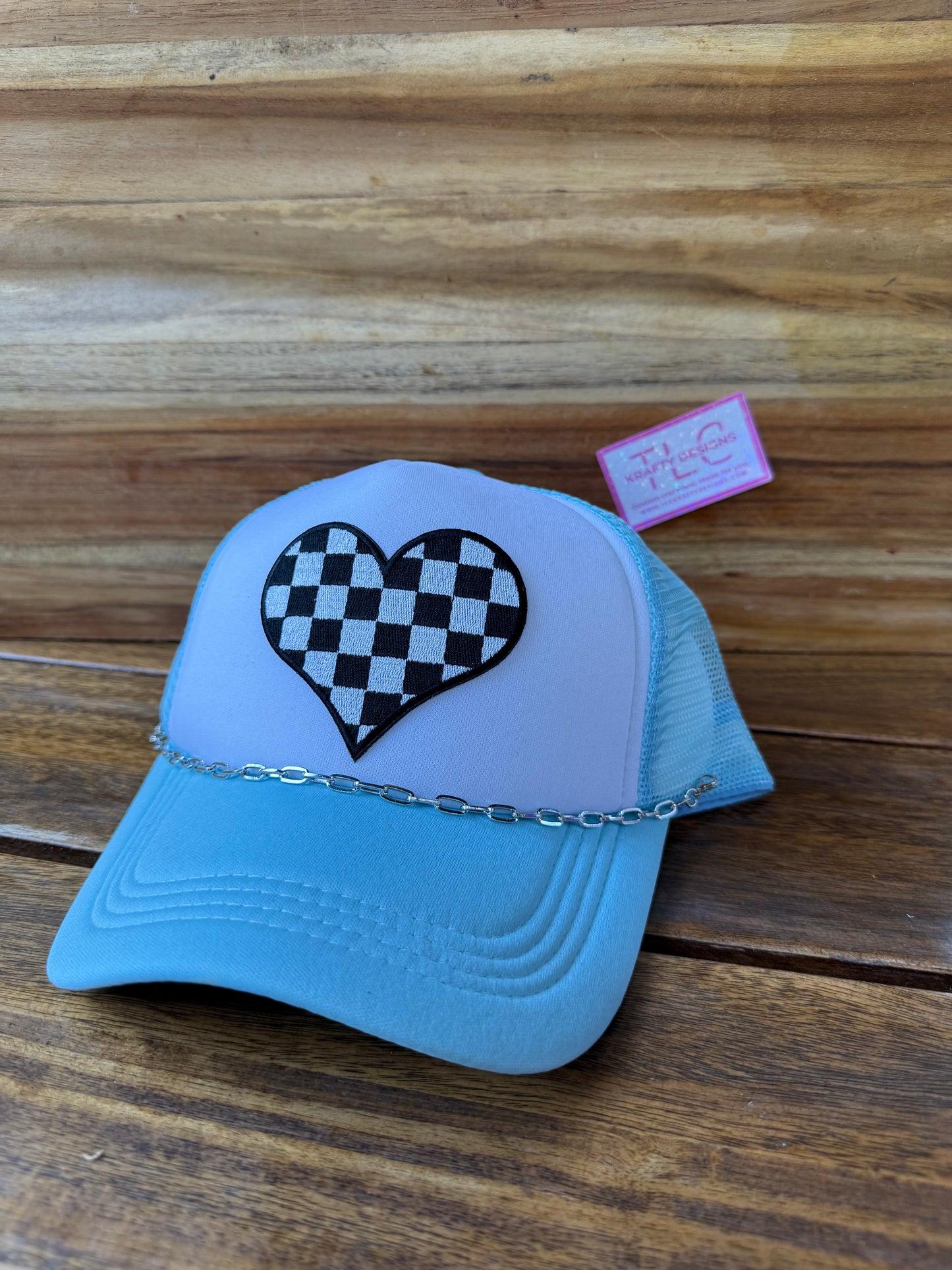 Checkerboard Heart Trucker Hat – Light Blue with Chain Accent and Mesh Back