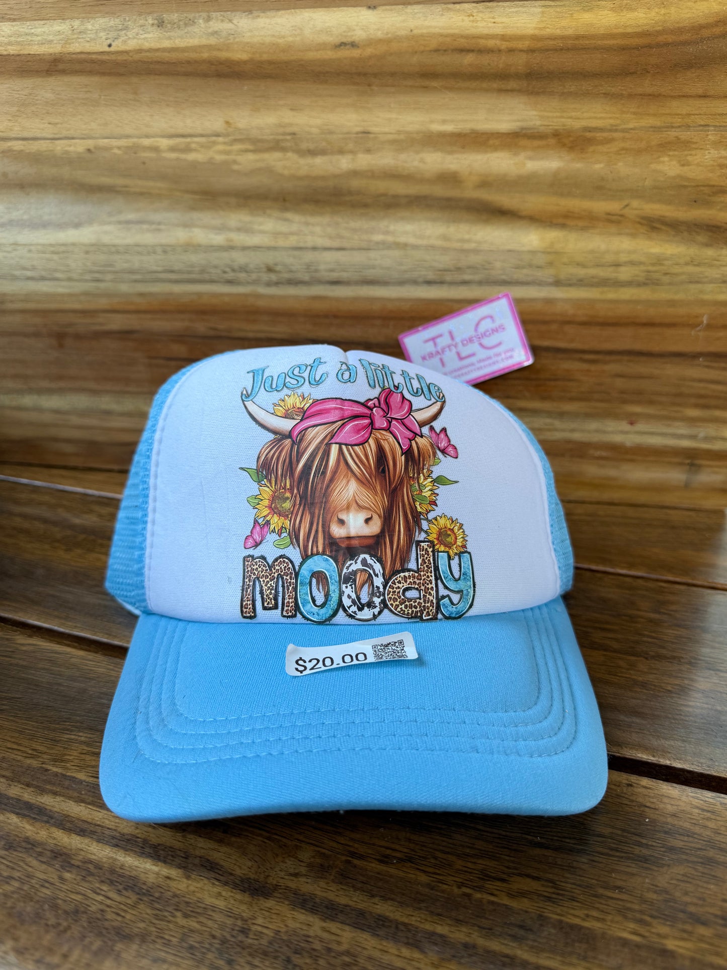 Just a Little Moody Trucker Hat – Highland Cow Floral Design on Light Blue Cap