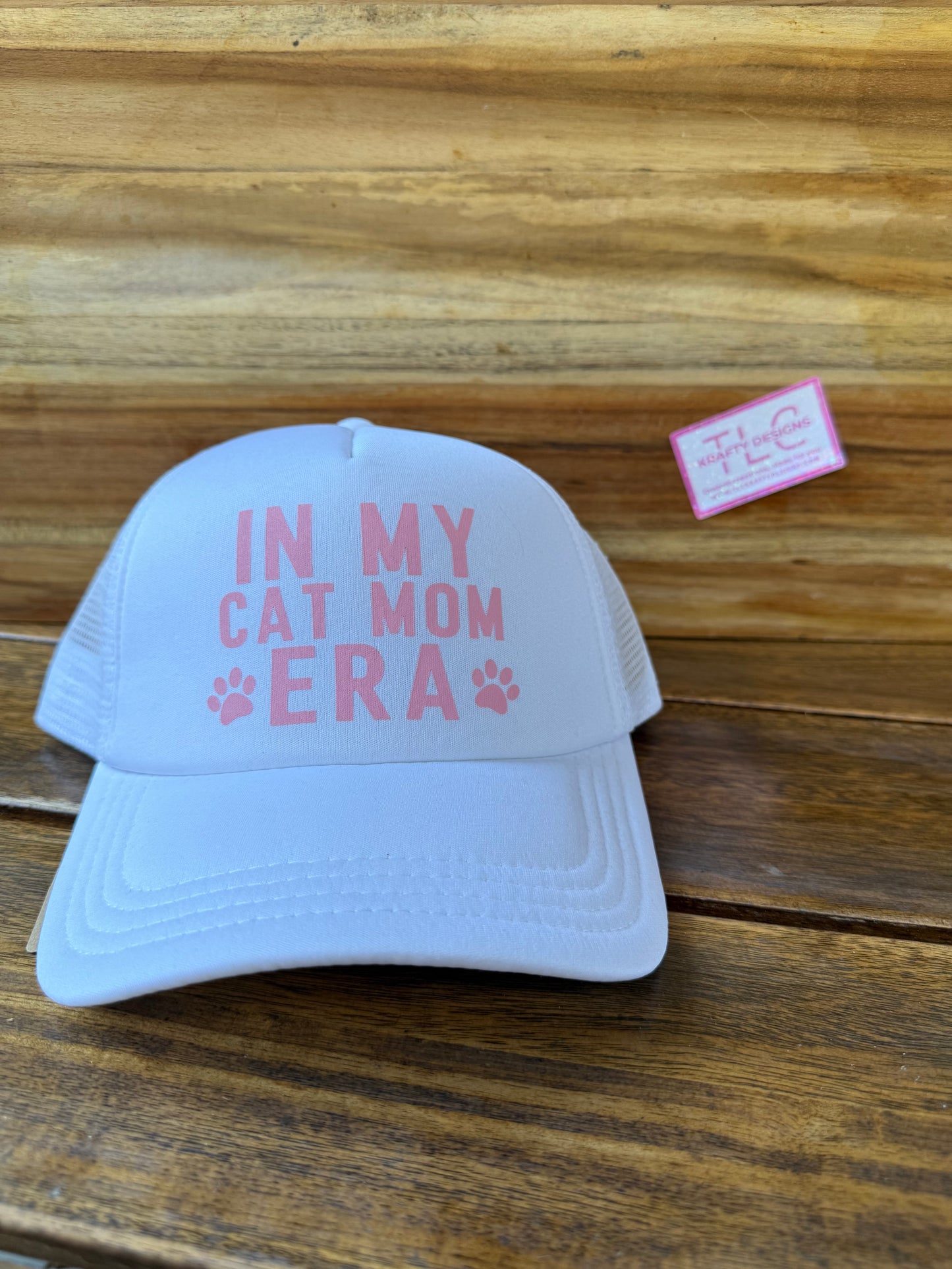 White Trucker Hat – “In My Cat Mom Era” with Pink Paw Prints