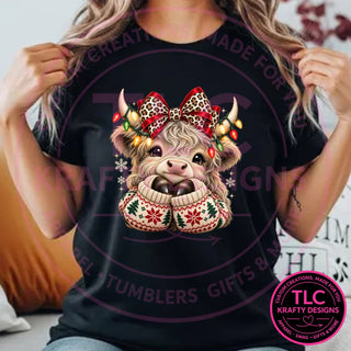 Highland Cow Christmas Bow design on a black t-shirt