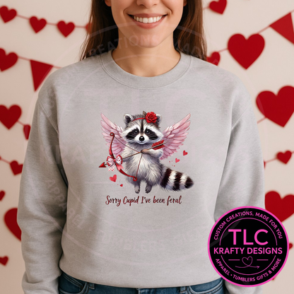 Sorry Cupid I’ve Been Feral Raccoon Sweatshirt or T-Shirt – Funny Valentine Raccoon Apparel