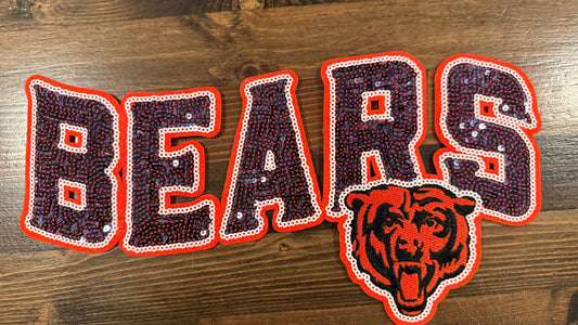 Decorative patch with 'BEARS' text and bear logo on a wooden surface
