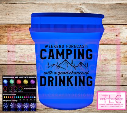 Light up LED bucket with 'Weekend Forecast: Camping with a good chance of Drinking' text on a wooden background