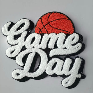 Embroidered patch with 'Game Day' text and a basketball on a gray background