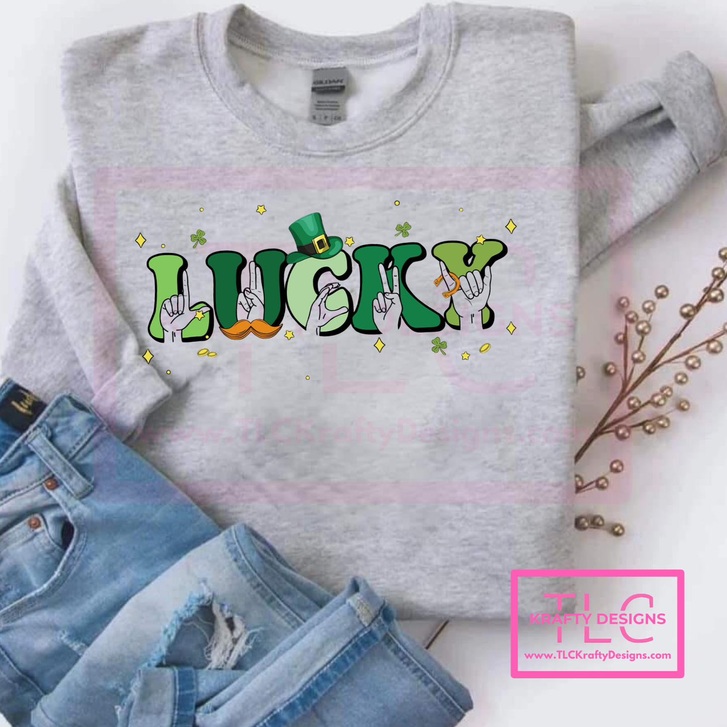 Gray sweatshirt with 'LUCKY' graphic design on a white background, paired with denim jeans.