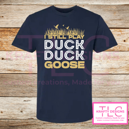 I Still Play Duck Duck Goose Shirt – Funny Hunting & Outdoor Graphic Tee