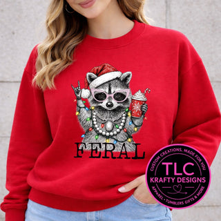 Feral Christmas Raccoon design on a red crewneck sweatshirt