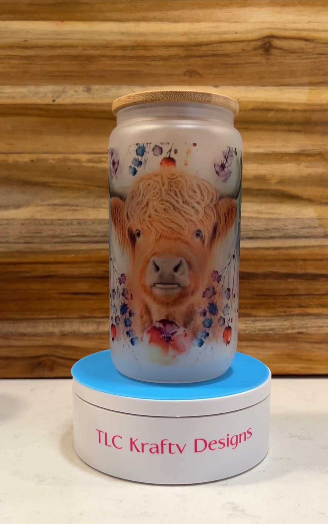 Highland Cow surrounded by whimsical flowers 16oz. Sublimation tumbler