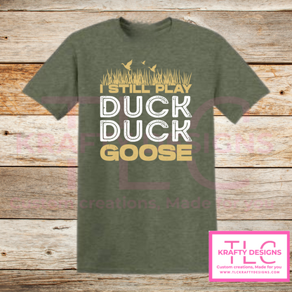 I Still Play Duck Duck Goose Shirt – Funny Hunting & Outdoor Graphic Tee