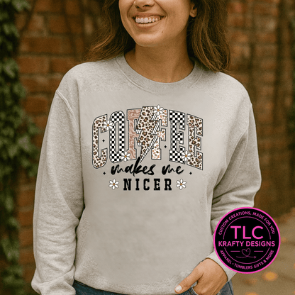 Person wearing a gray sweatshirt with a colorful graphic and text, standing against a brick wall.