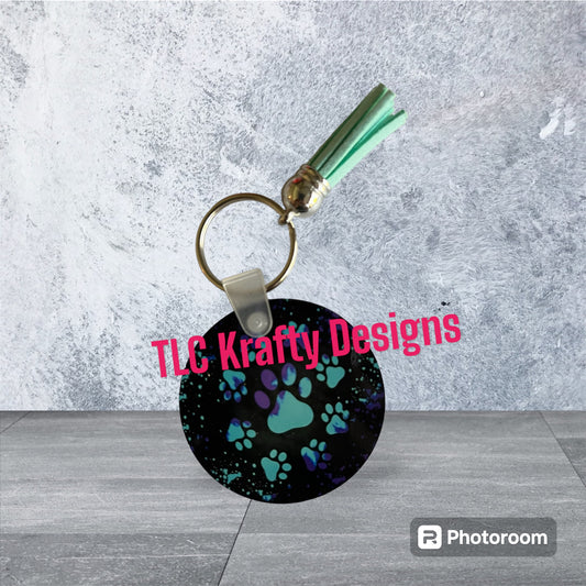 Bright colorful Blue pawprints to represent the fur-baby Keychain with Tassel