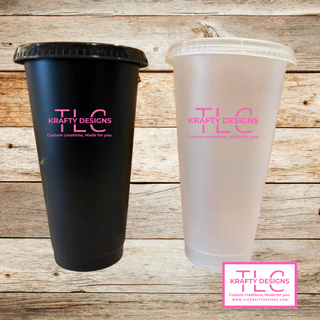 Black and clear plastic cups with 'Krafty Designs TLC' branding on a wooden background.