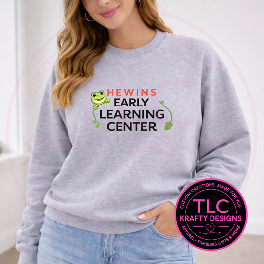 Hewins Early Learning Center Apparel - Frog Face With Black Lettering