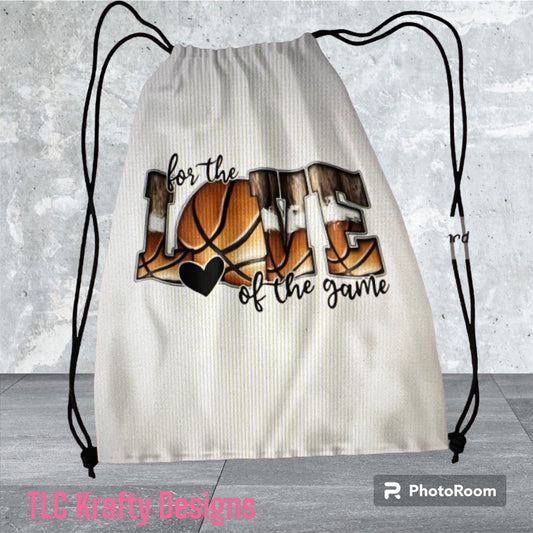Spirited drawstring bag featuring the phrase "For the love of the game" alongside an iconic basketball image.