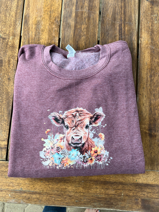 Highland Cow in a bed of flowers crewneck Sweatshirt
