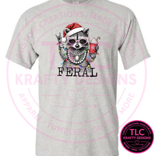 Feral Christmas Raccoon design on an ash t-shirt