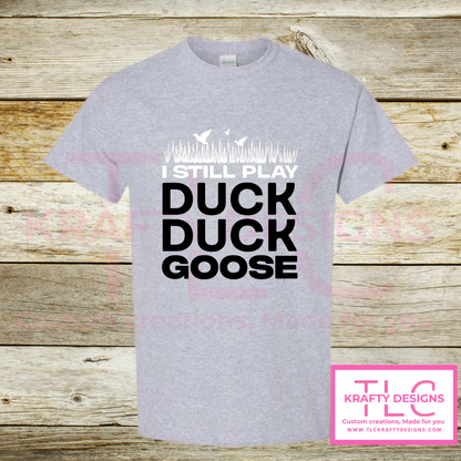 I Still Play Duck Duck Goose Shirt – Funny Hunting & Outdoor Graphic Tee