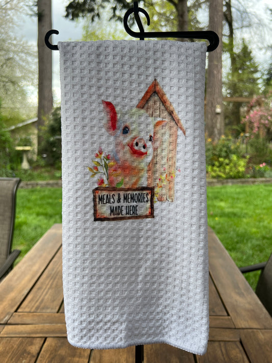 Meals & Memories Made here kitchen towel display a cute baby pig