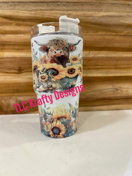 Highland Cow in a bucket in bed of sunflowers 20oz tumbler