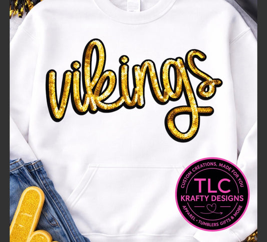 White hoodie with 'vikings' in gold text and TLC Krafty Designs logo.