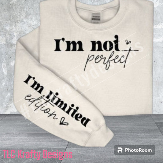 Cozy crew neck sweatshirt making a bold statement with "I'm not perfect" elegantly written on the front, complemented by a touch of uniqueness with "I'm limited edition" discreetly gracing the sleeve.