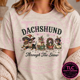 Dachshund Through The Snow design on a heathered oatmeal t-shirt