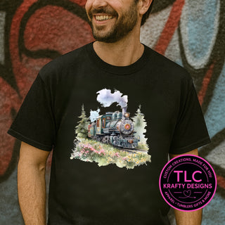 Watercolor steam train design — painted locomotive with wildflowers and pines on a black tee