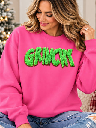 Green Man chenille patch in green on pink crewneck sweatshirt
