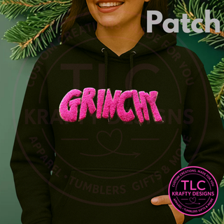 Grinchy patch in Pink on a black hoodie