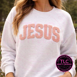 JESUS fuzzy patch on white crewneck sweatshirt