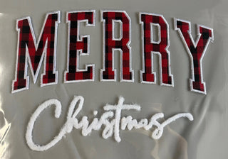 Merry Christmas patch close-up - buffalo plaid embroidered MERRY letters and white fuzzy Christmas script