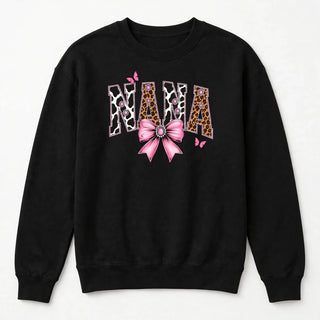 NANA cow print varsity design on black sweatshirt