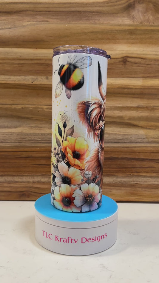 Whimsical 20 oz sublimation tumbler, where the charm of a highland cow meets the playful allure of sunglasses and flowers