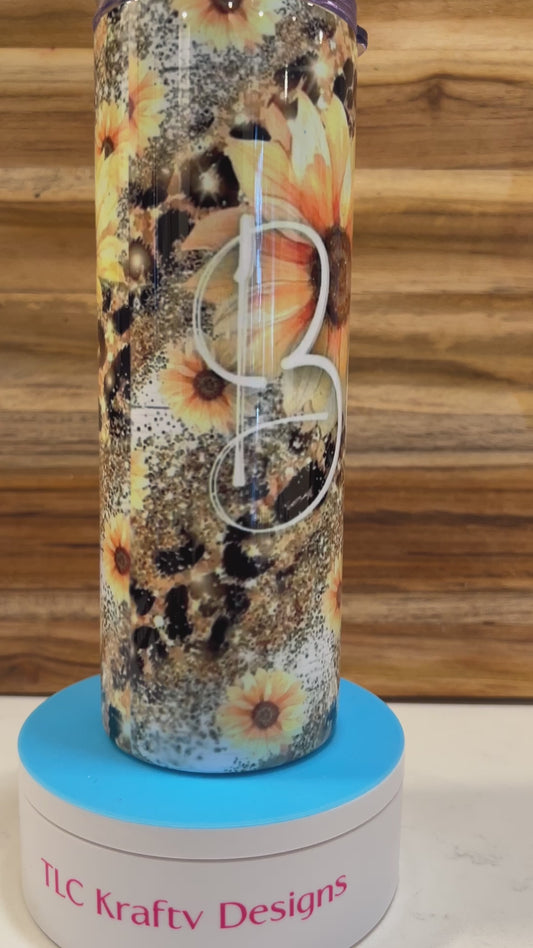 Striking 20 oz sublimation tumbler, where the timeless beauty of sunflowers meets the fierce elegance of leopard print