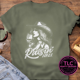 Raisin Hell Cowgirl design mockup on heathered military green t-shirt