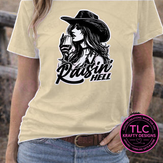 Raisin Hell Cowgirl design mockup on sand t-shirt