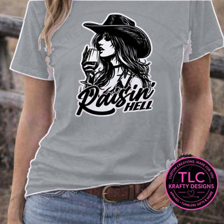 Raisin Hell Cowgirl design mockup on sports gray t-shirt