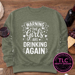 Warning The Girls Are Drinking Again design mockup on heathered military green sweatshirt