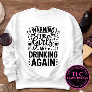 Warning The Girls Are Drinking Again design mockup on white sweatshirt